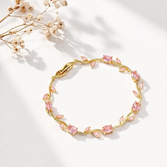 18K gold plated stainless steel anti tarnish jewelry bracelet with pink gems and floral design.