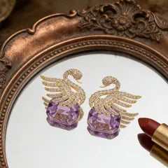 Ethonica Swan Stud Earrings with Purple Crystal Gemstone, Gold-Tone Pavé Rhinestone Wings.