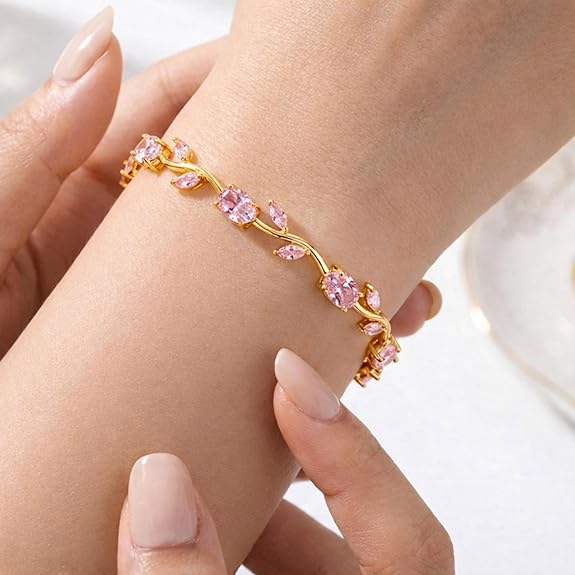 18K gold plated pink crystal floral bracelet highlighting anti tarnish jewelry features worn on wrist.
