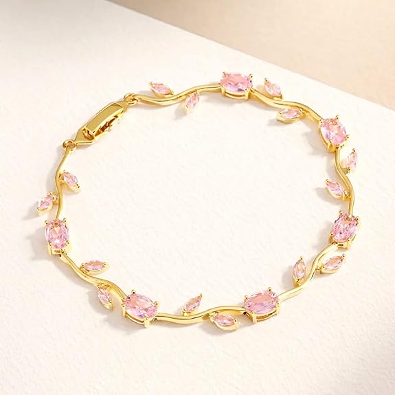 Anti tarnish jewelry featuring a stunning gold bracelet with pink gemstones and elegant leaf motifs.